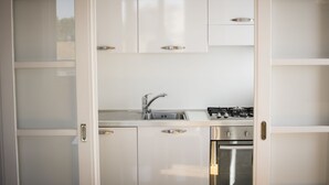 Apartamento, 3 quartos | Cozinha privada