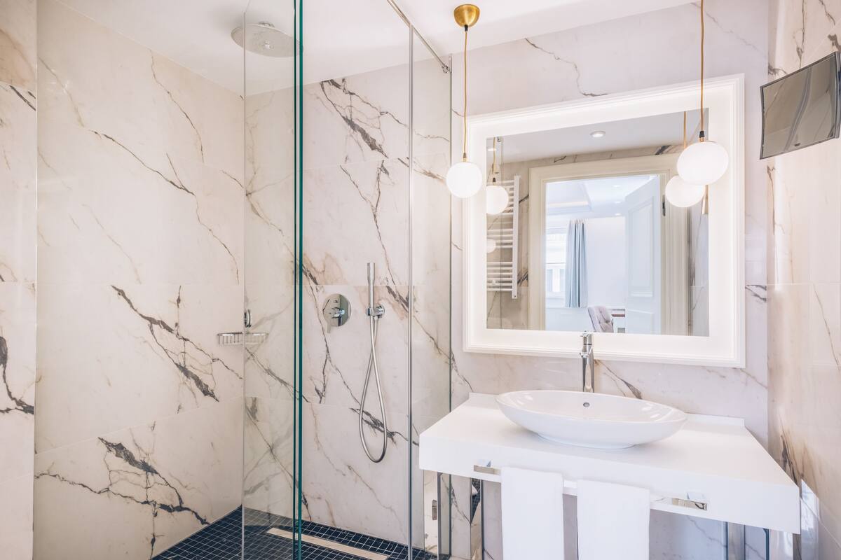 eco-friendly toiletries, hair dryer, bathrobes, slippers