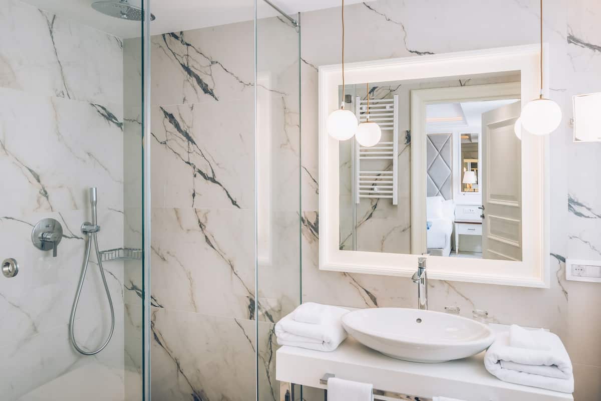 eco-friendly toiletries, hair dryer, bathrobes, slippers