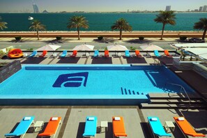 Outdoor pool, pool umbrellas, sun loungers