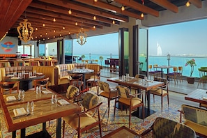 3 bars/lounges, poolside bar, beach bar