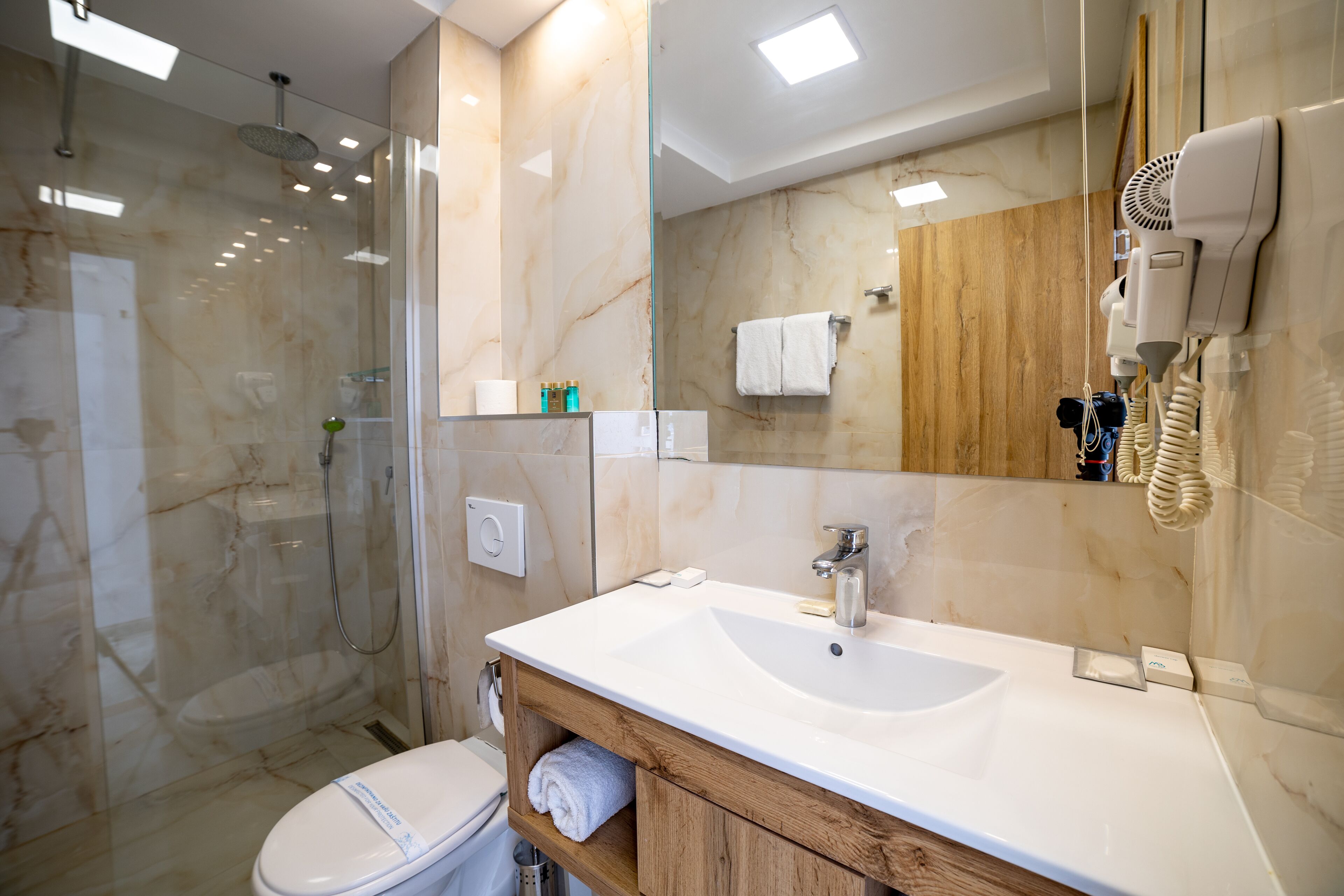 family suite | bathroom | shower, rainfall showerhead, free toiletries, hair dryer