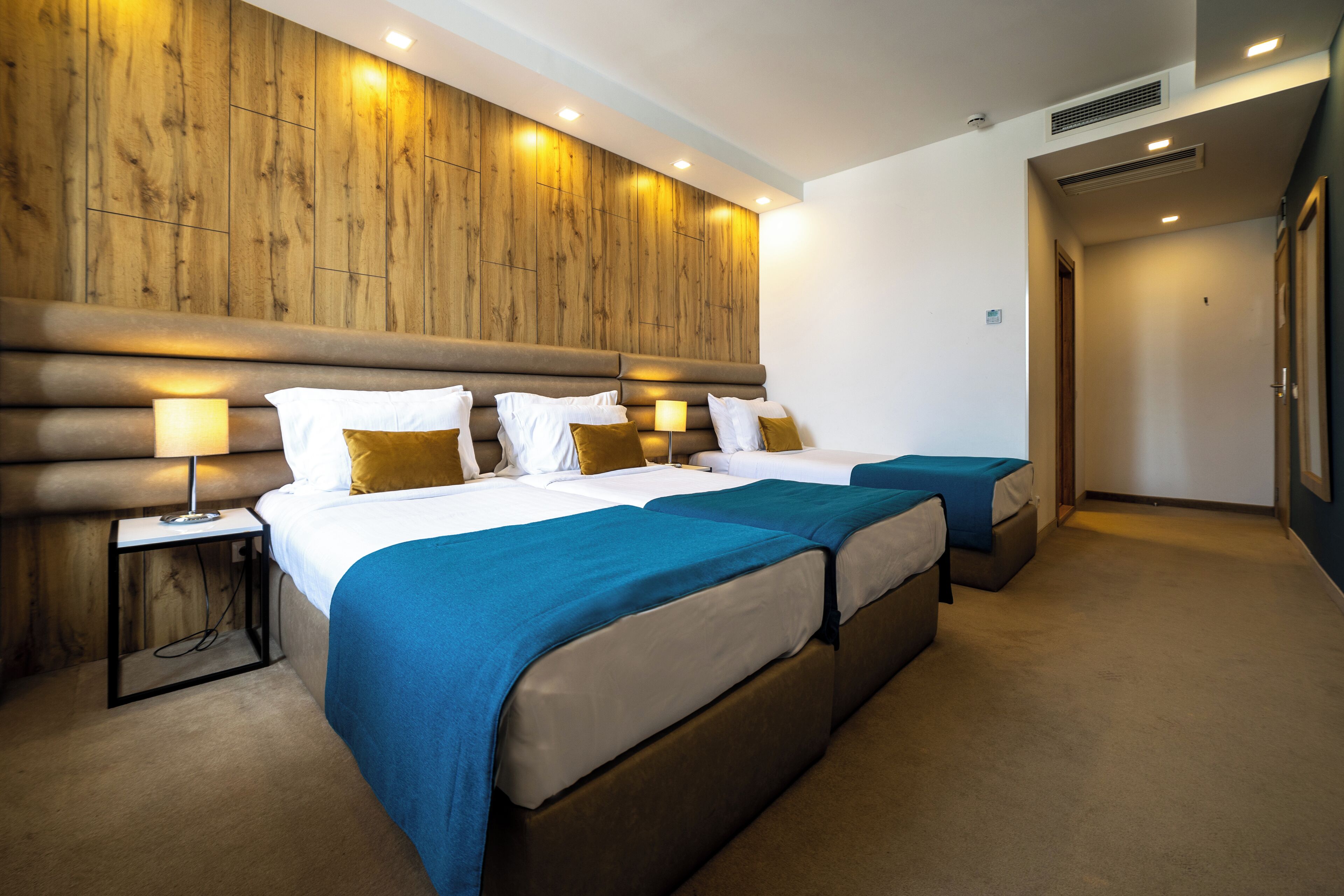 elite triple room | premium bedding, memory-foam beds, minibar, in-room safe