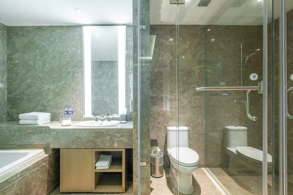 Suite, 1 Bedroom | Bathroom | Shower, free toiletries, hair dryer, slippers