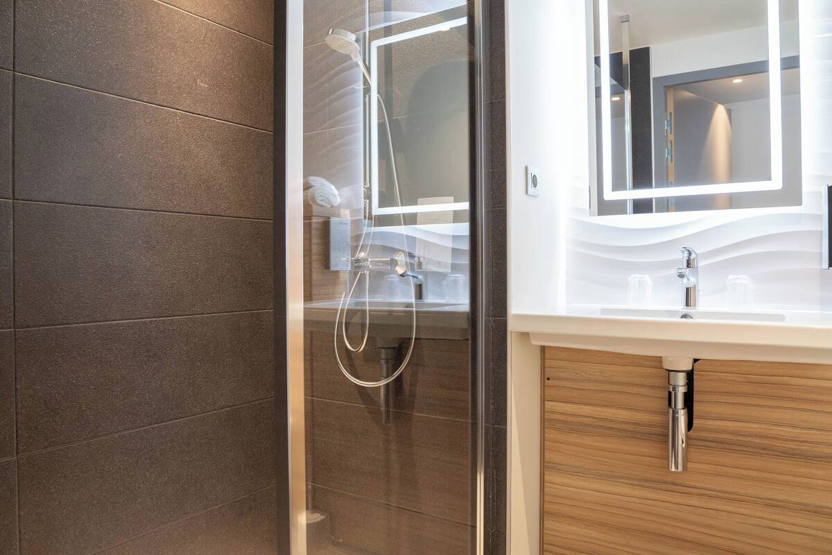 shower, eco-friendly toiletries, hair dryer, towels