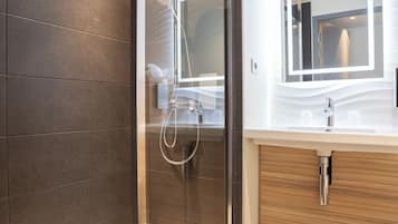 Shower, eco-friendly toiletries, hair dryer, towels