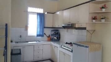 Villa, 4 Bedrooms | Private kitchen | Fridge, stovetop, electric kettle, rice cooker