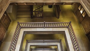 A multi-level wooden staircase with a handrail and a wooden balustrade. - Nepali Ghar Hotel, Thamel – Your Home in Nepal (Kathmandu)