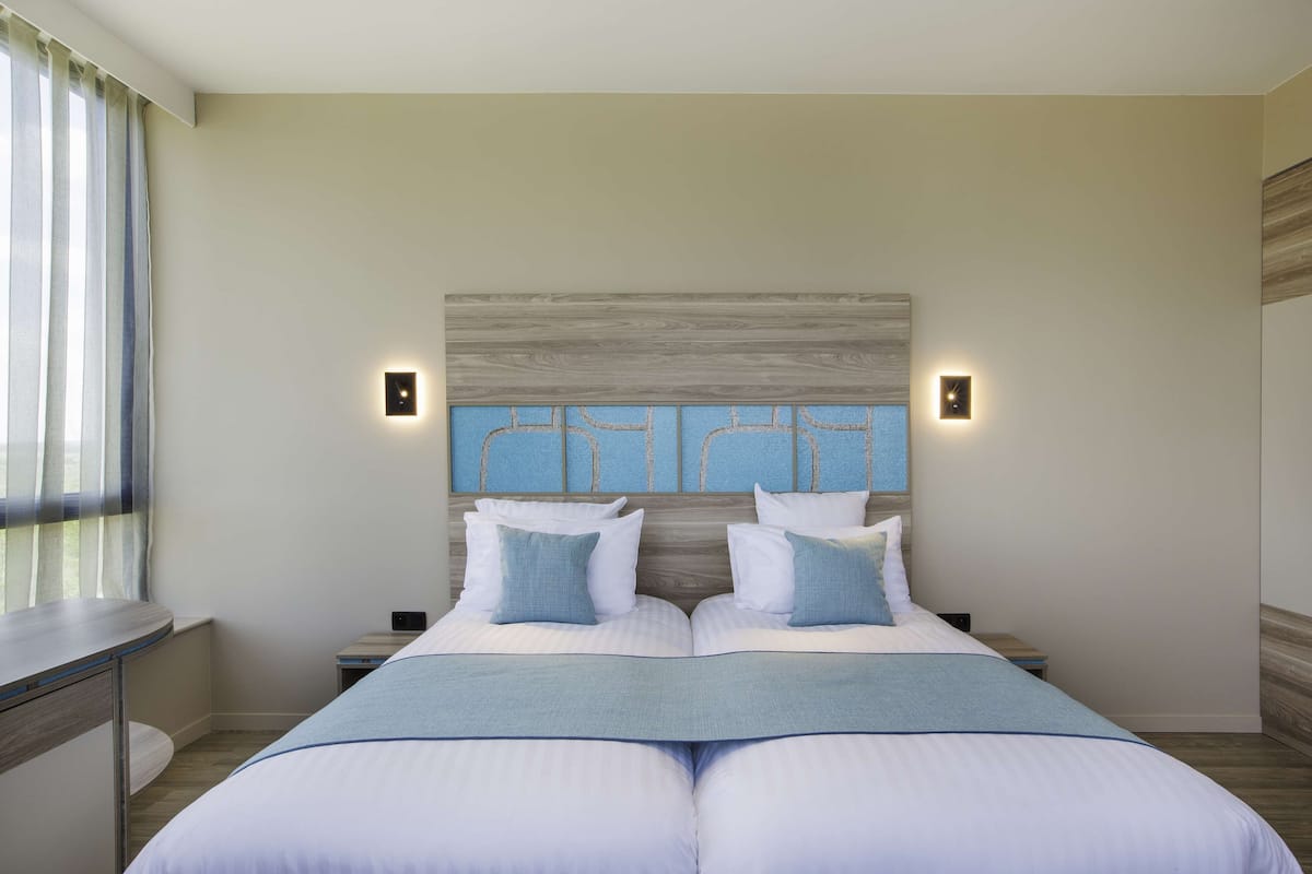 Ropa de cama de alta calidad y camas con pillow-top