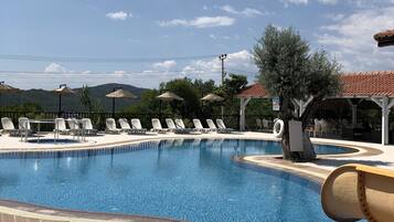 Outdoor pool, pool umbrellas, sun loungers