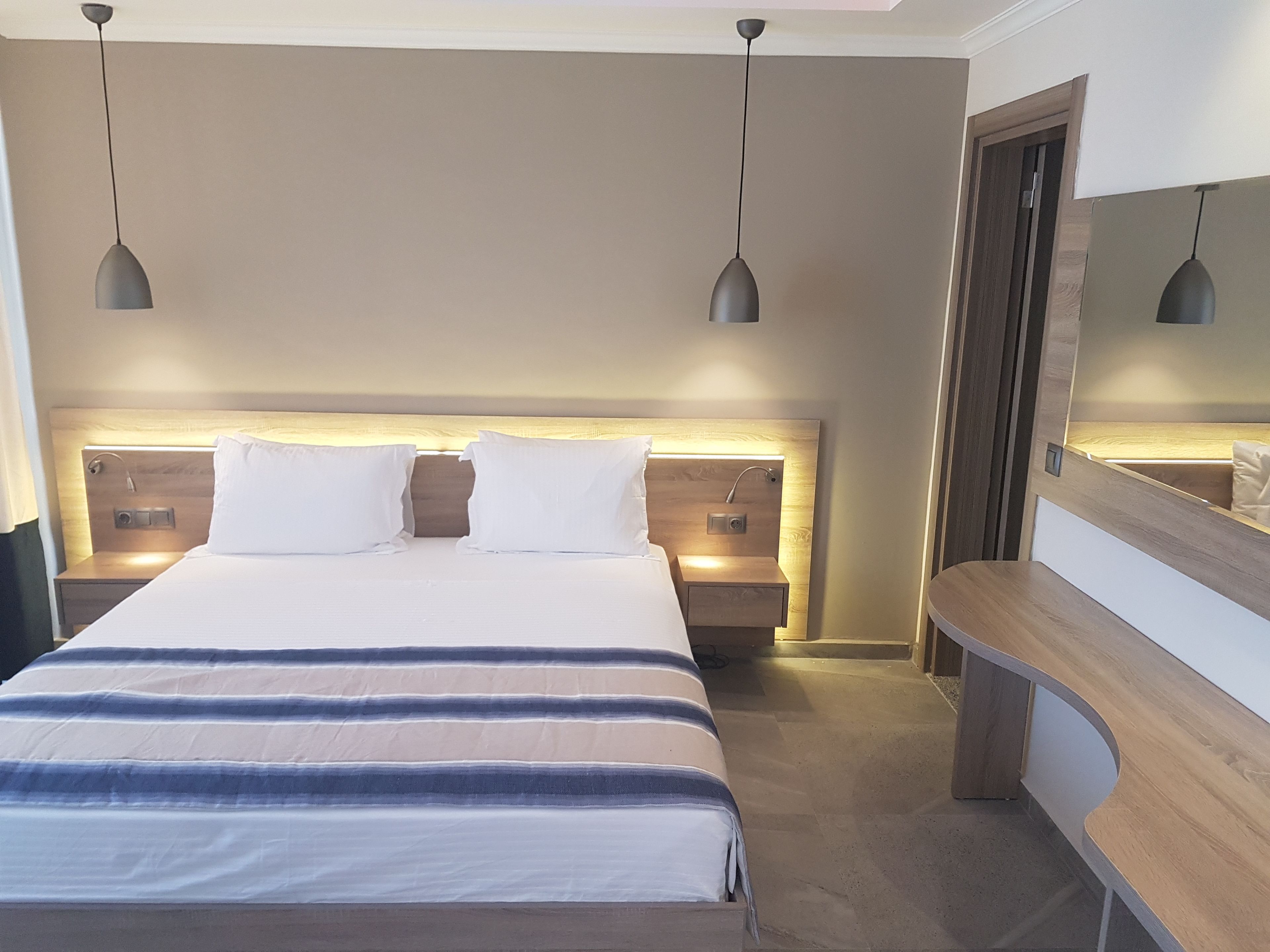 deluxe quadruple room | premium bedding, memory-foam beds, minibar, in-room safe