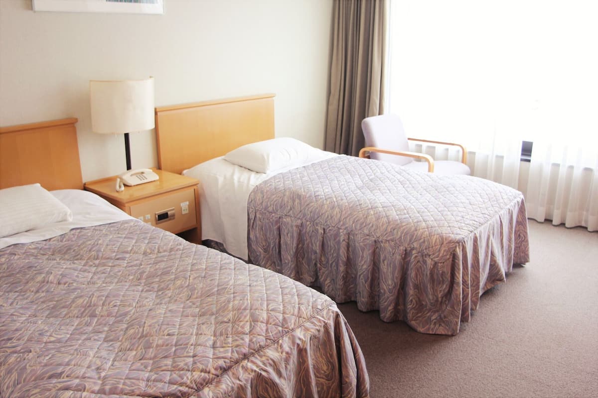 Western-Style Twin Room, Main Building, Private Bathroom | In-room safe, desk, free WiFi, bed sheets