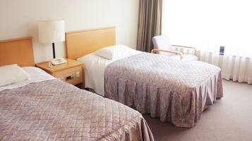 Værelse med 2 enkeltsenge - privat badeværelse (Western-Style, Main Building) | Pengeskab på værelset, skrivebord, gratis Wi-Fi, sengetøj