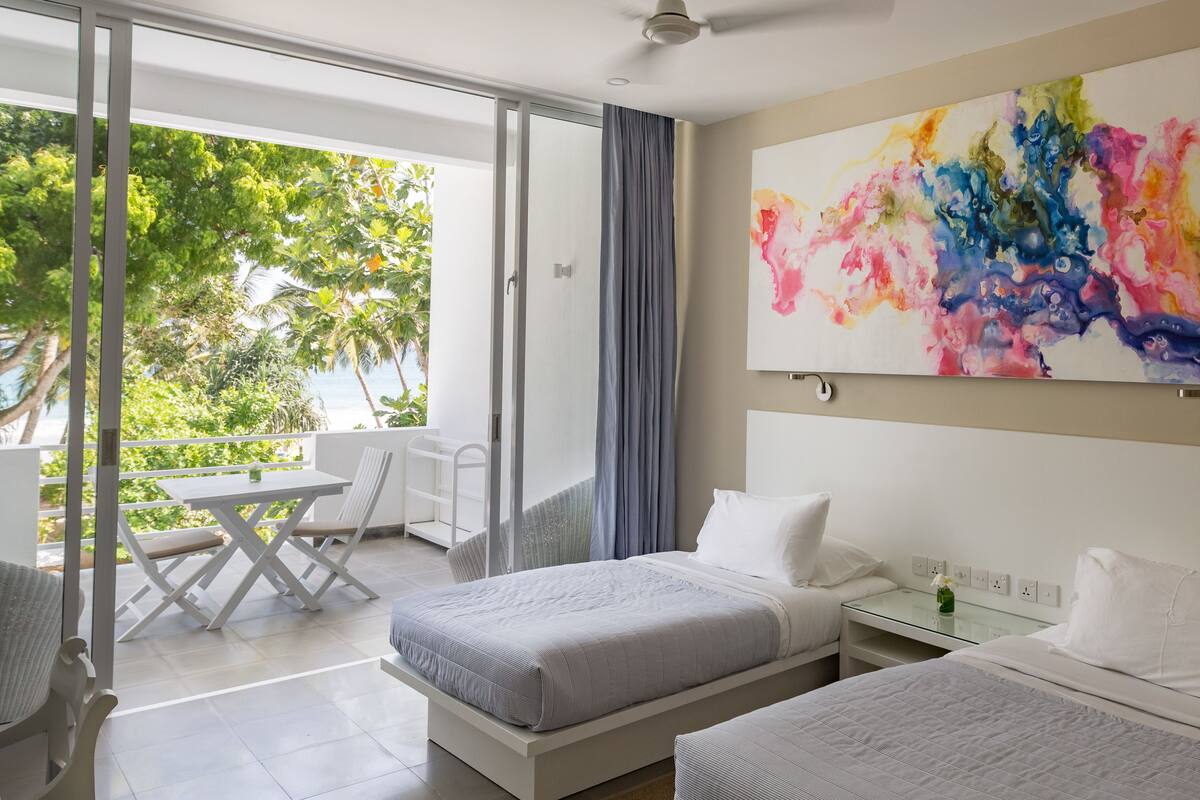Superior kamer, uitzicht op oceaan | Luxe beddengoed, een minibar, een bureau, een laptopwerkplek