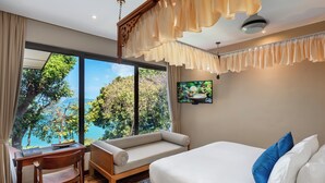 A bedroom with a large window, a bed, a desk, and a chair. - Ambong Pool Villas (Langkawi)