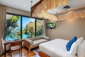 A bedroom with a large window, a bed, a desk, and a chair. - Ambong Pool Villas (Langkawi)