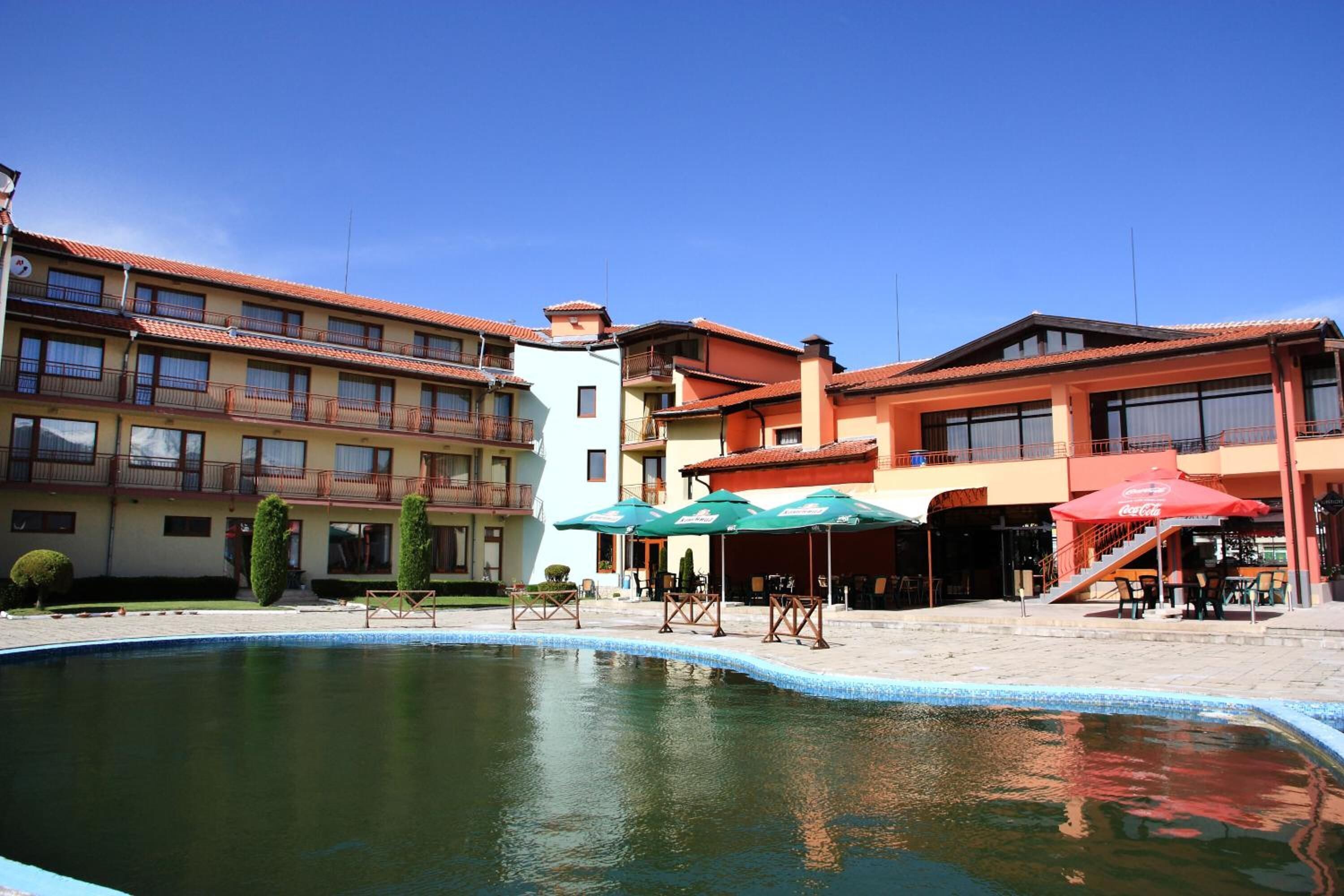 Seasonal outdoor pool, open 7:30 AM to 7:30 PM, pool umbrellas