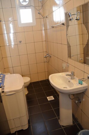 Shower, free toiletries, hair dryer, slippers