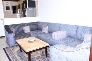 Apartment, 1 Bedroom | Living room | 32-inch LCD TV with satellite channels, TV