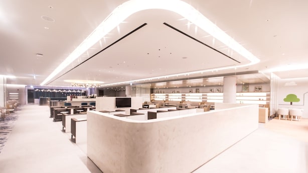 A modern hotel lobby with a central reception desk, seating areas, and a chandelier. - Incheon Airport Transit Hotel - Terminal 2 (Incheon)
