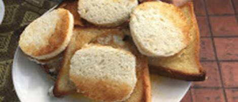 A plate with several slices of toast.