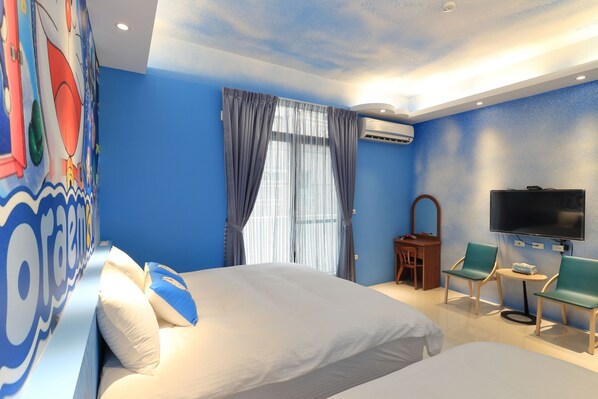 A hotel room with two beds, a TV, a small table, and a chair.