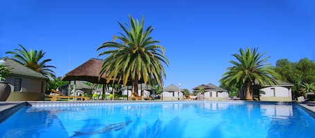 Outdoor pool, open 8 AM to 7 PM, pool umbrellas, sun loungers
