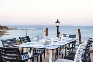 Breakfast, lunch, dinner served; beach views