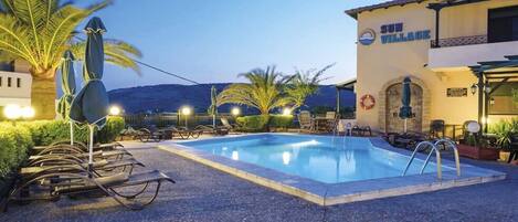 Seasonal outdoor pool, pool umbrellas, pool loungers