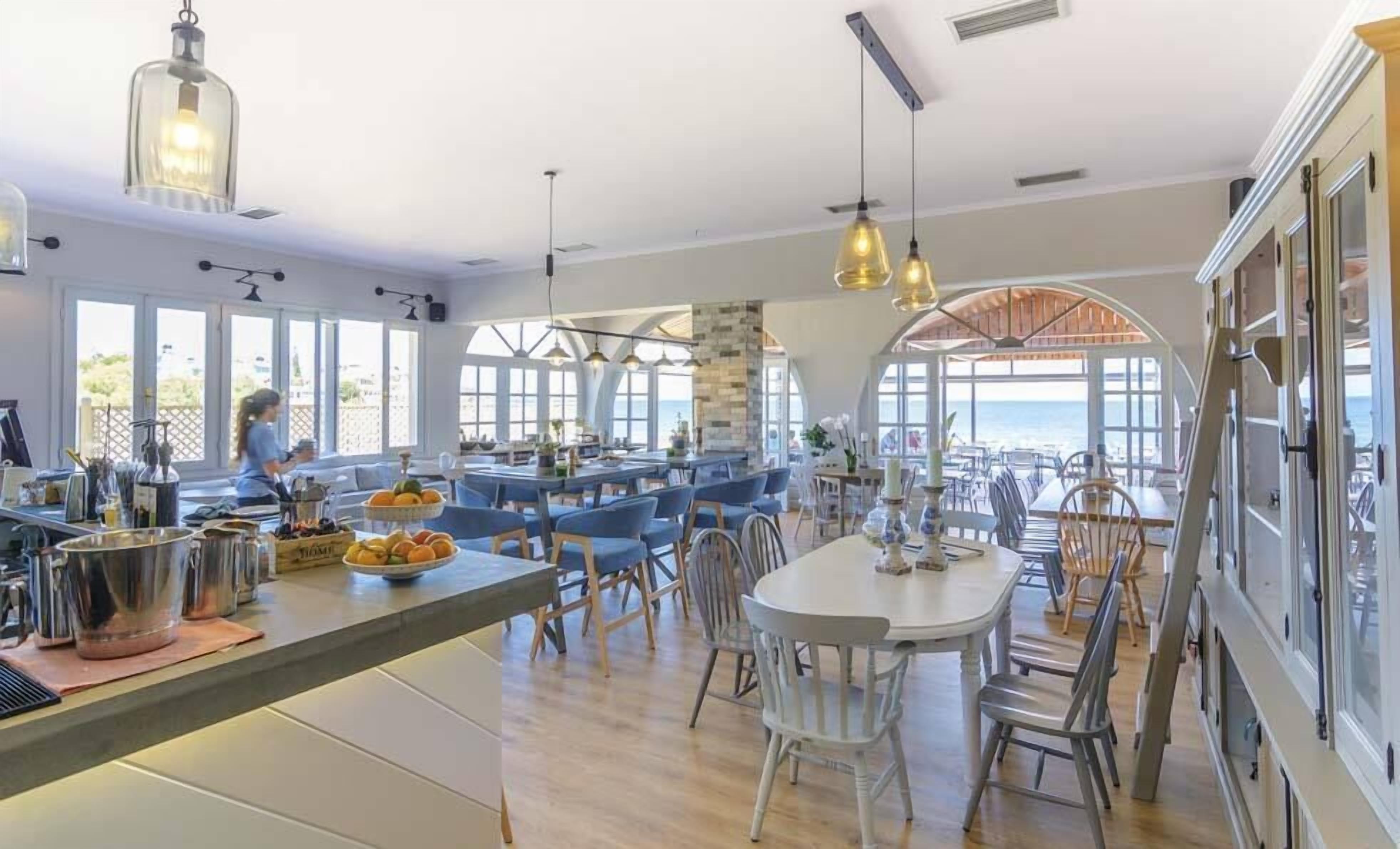 Breakfast, lunch, dinner served; beach views