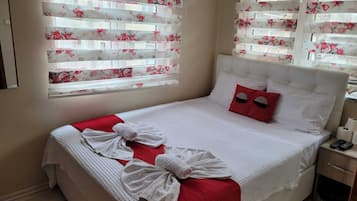 Desk, laptop workspace, free WiFi, bed sheets