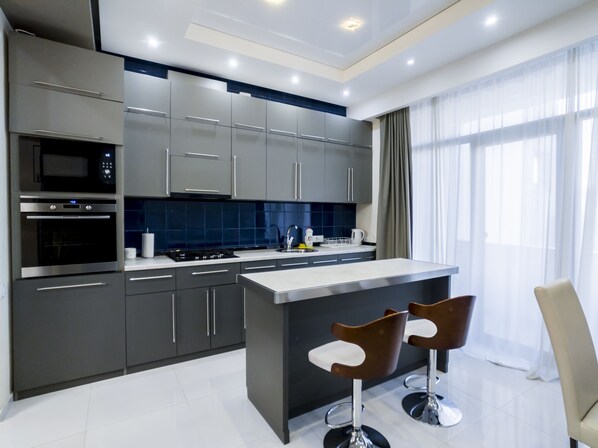 Family Apartment, 3 Bedrooms | Private kitchen | Fridge, microwave, coffee/tea maker, highchair - Tbilisi Core - Libra (Tbilisi)