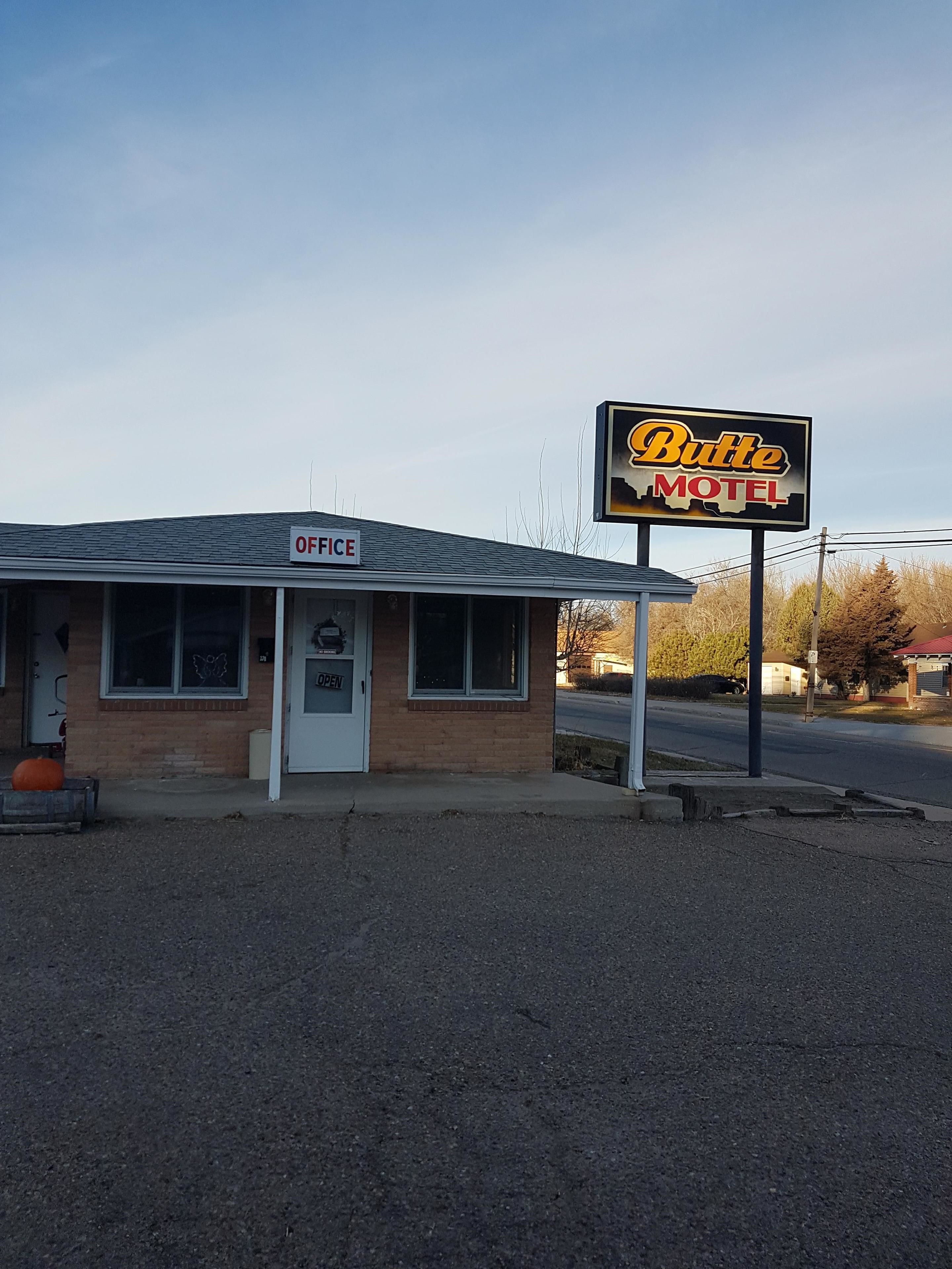 A building with a sign reading "Butte Motel" and an "Office" sign above the entrance.
