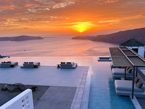 Seasonal outdoor pool, open 8:30 AM to 8:00 PM, pool umbrellas