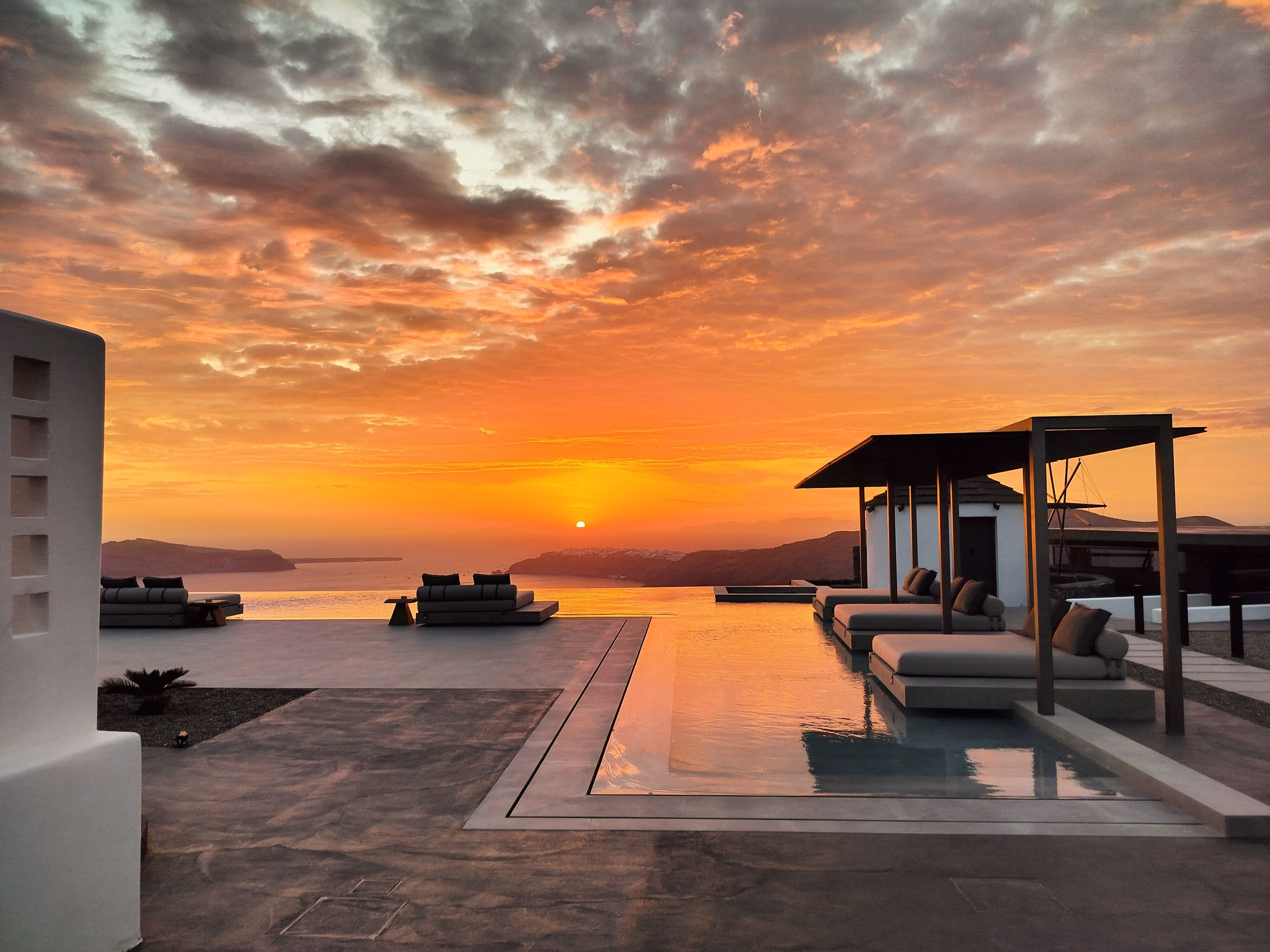 Seasonal outdoor pool, open 8:30 AM to 8:00 PM, pool umbrellas