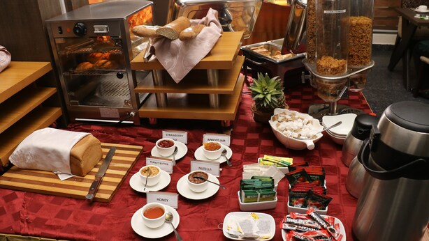 A breakfast buffet with various food items and beverages. - Best Western Plus By Bayse-LTD (Ibadan)