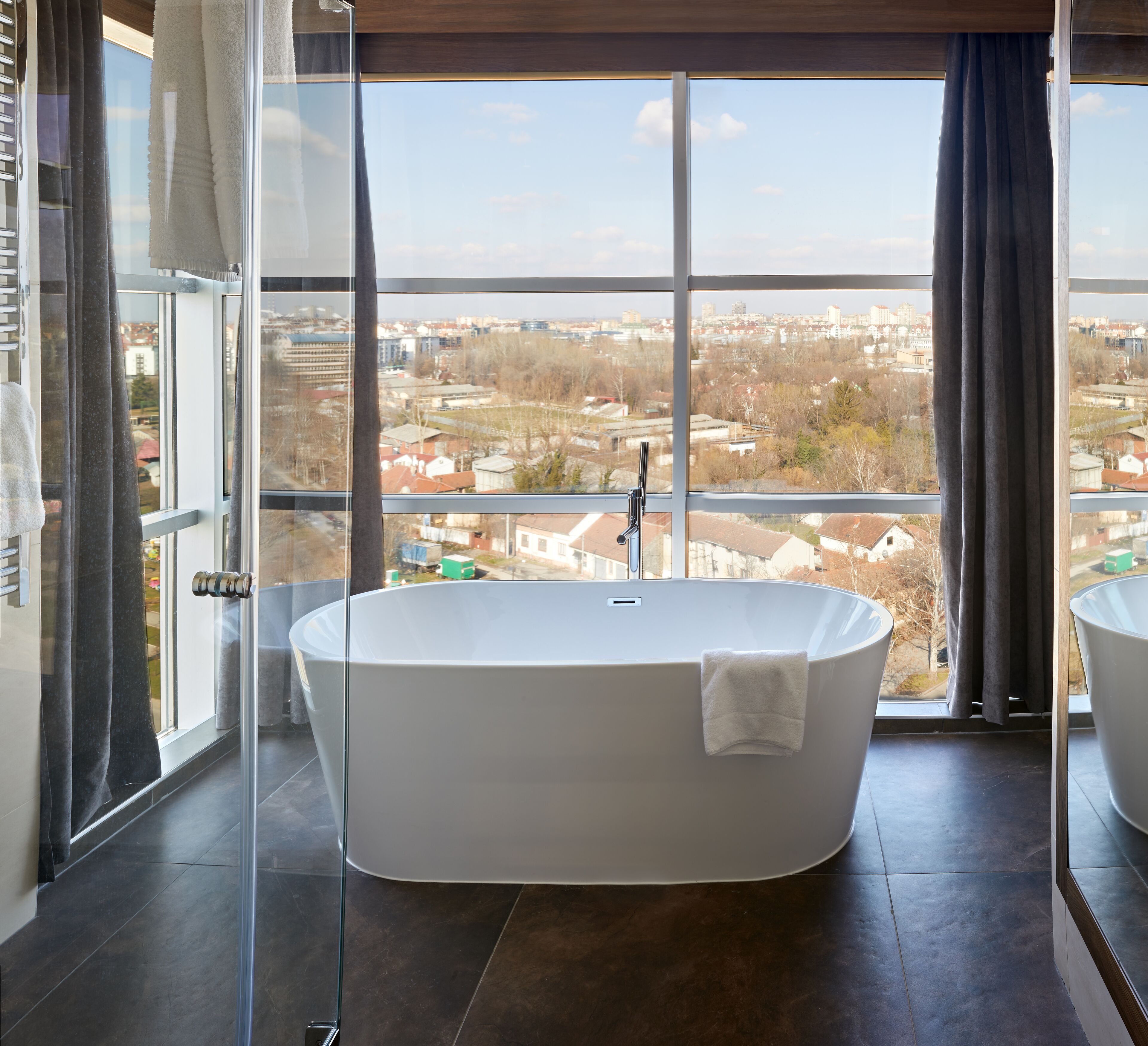 designer toiletries, hair dryer, bathrobes, slippers