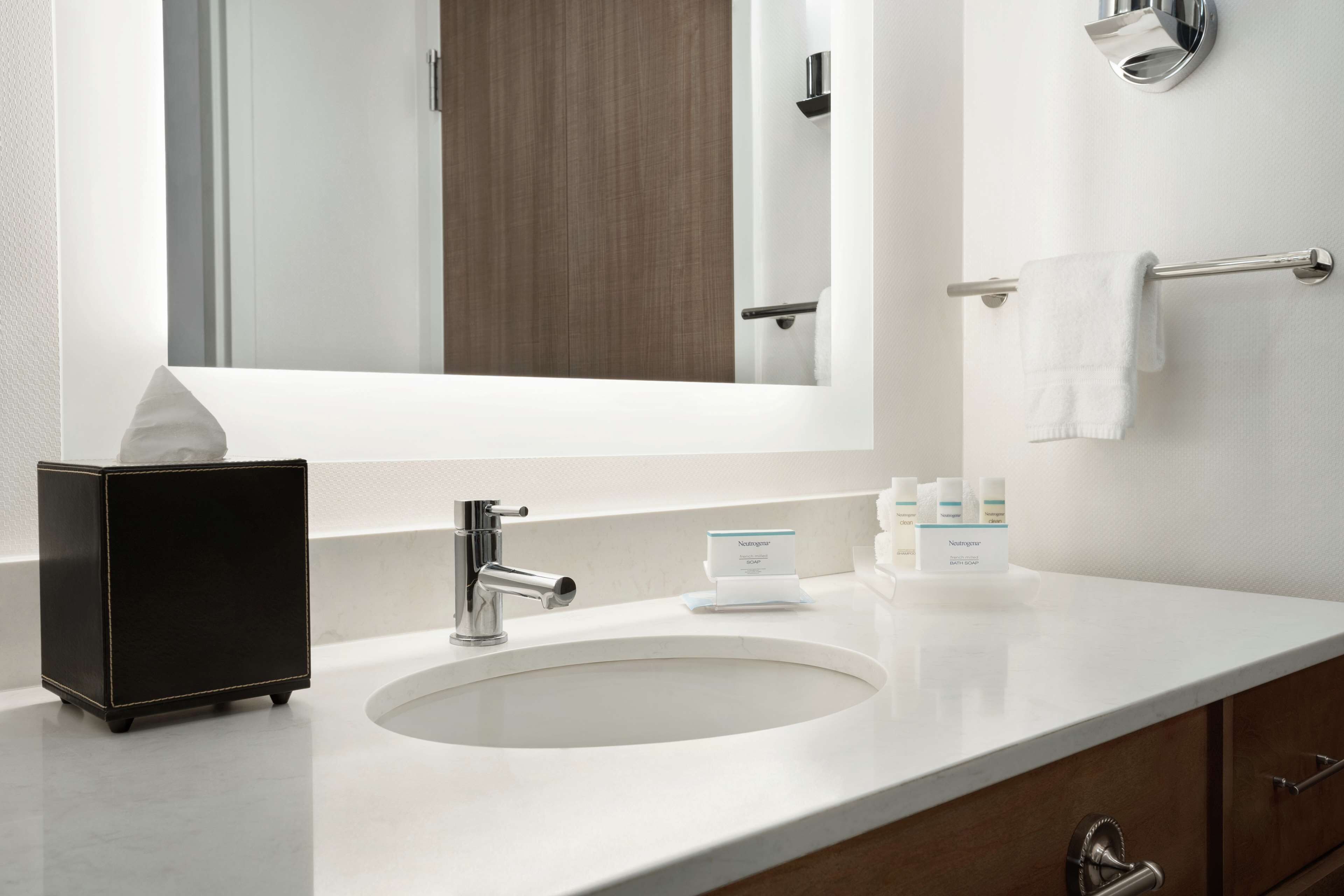 designer toiletries, hair dryer, towels, soap