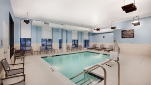 A swimming pool with lounge chairs and a view of the city. - Homewood Suites by Hilton Louisville Downtown, KY (Louisville)