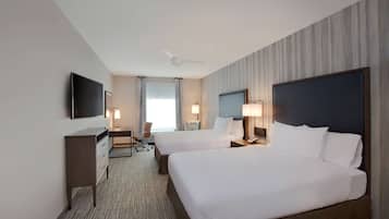 Premium bedding, desk, laptop workspace, blackout drapes