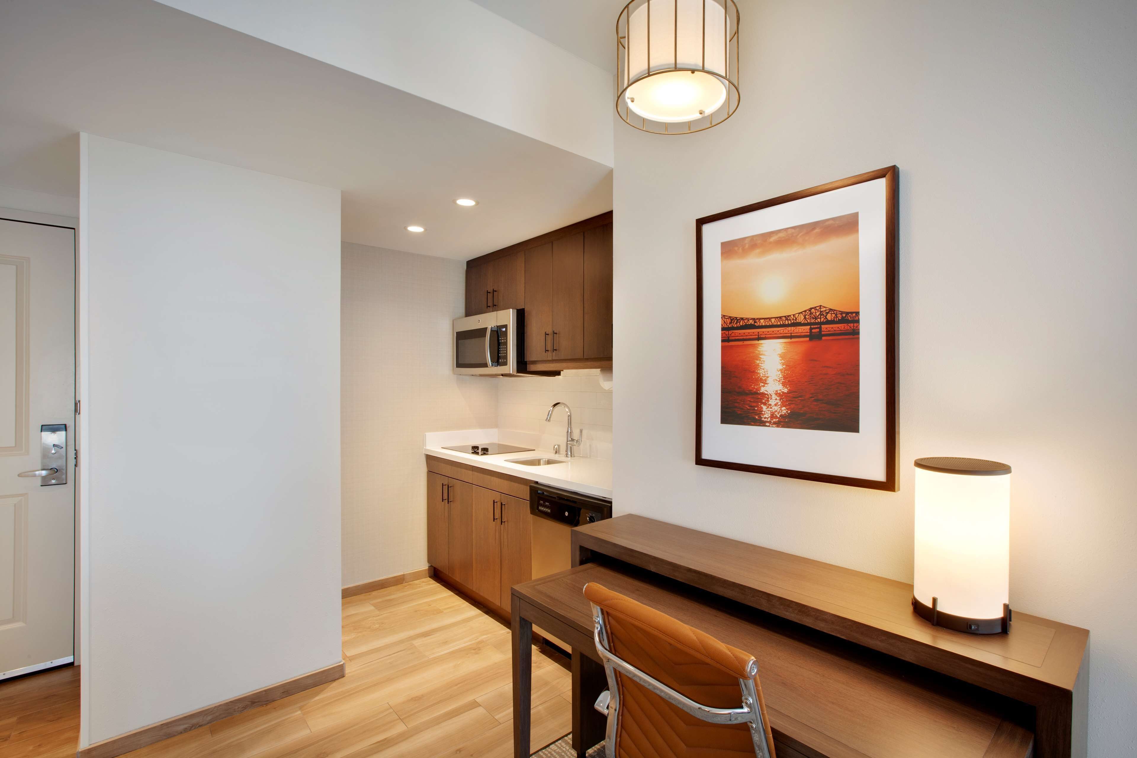 full-sized fridge, microwave, stovetop, dishwasher