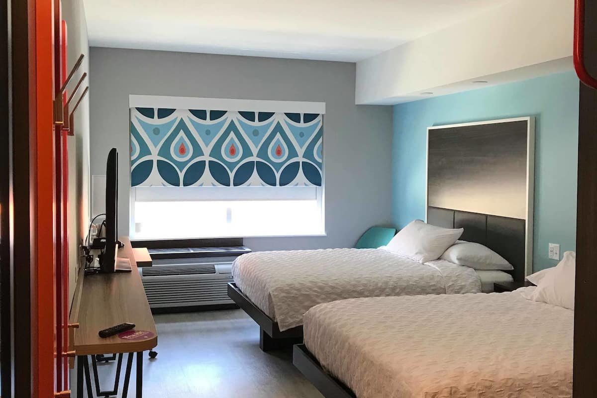 room, 2 queen beds | desk, iron/ironing board, free cots/infant beds, free wifi