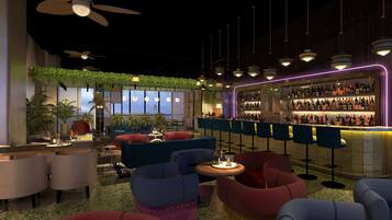 A modern bar area with seating, ceiling fans, hanging plants, and a bar stocked with bottles.