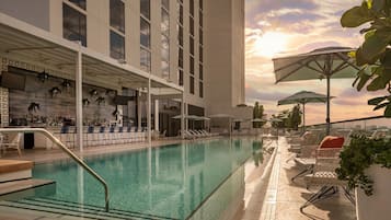 Outdoor pool, open 8 AM to 6 PM, pool cabanas (surcharge)