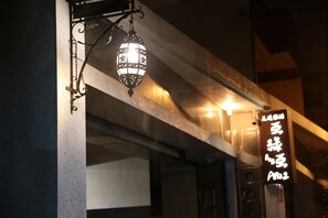 A street lamp and a sign with Japanese characters. - Aria2 home (Hualien City)
