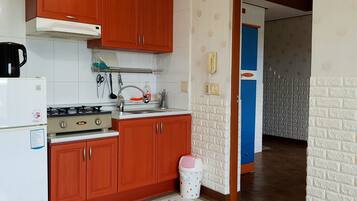 Standard Triple Room, 3 Bedrooms, Ocean View | Private kitchen | Fridge, microwave, rice cooker, cookware/dishes/utensils