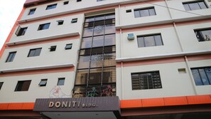A multi-story building with a sign reading "DONITI BLDG." - Doniti Suites and Events Place (Mandaluyong)