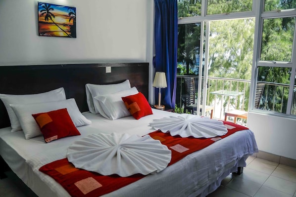 Deluxe Double Room, 1 King Bed, Beach View, Beachfront | 1 bedroom, minibar, desk, blackout curtains