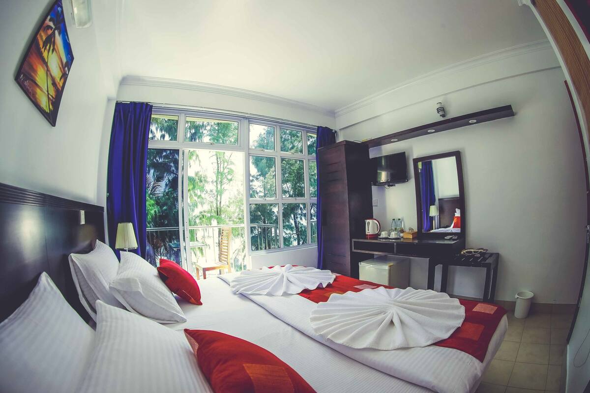 Deluxe Double Room, 1 King Bed, Beach View, Beachfront | 1 bedroom, minibar, desk, blackout curtains