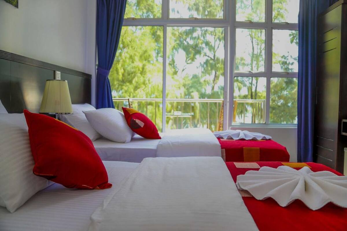 Deluxe Twin Room, 2 Single Beds, Beach View | 1 bedroom, minibar, desk, blackout curtains